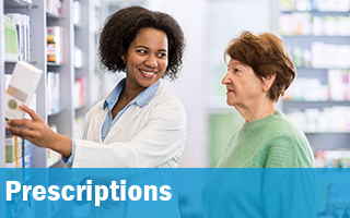 Pharmacist speaking to a women about prescriptions.