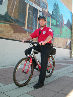 Redshirt member riding bike