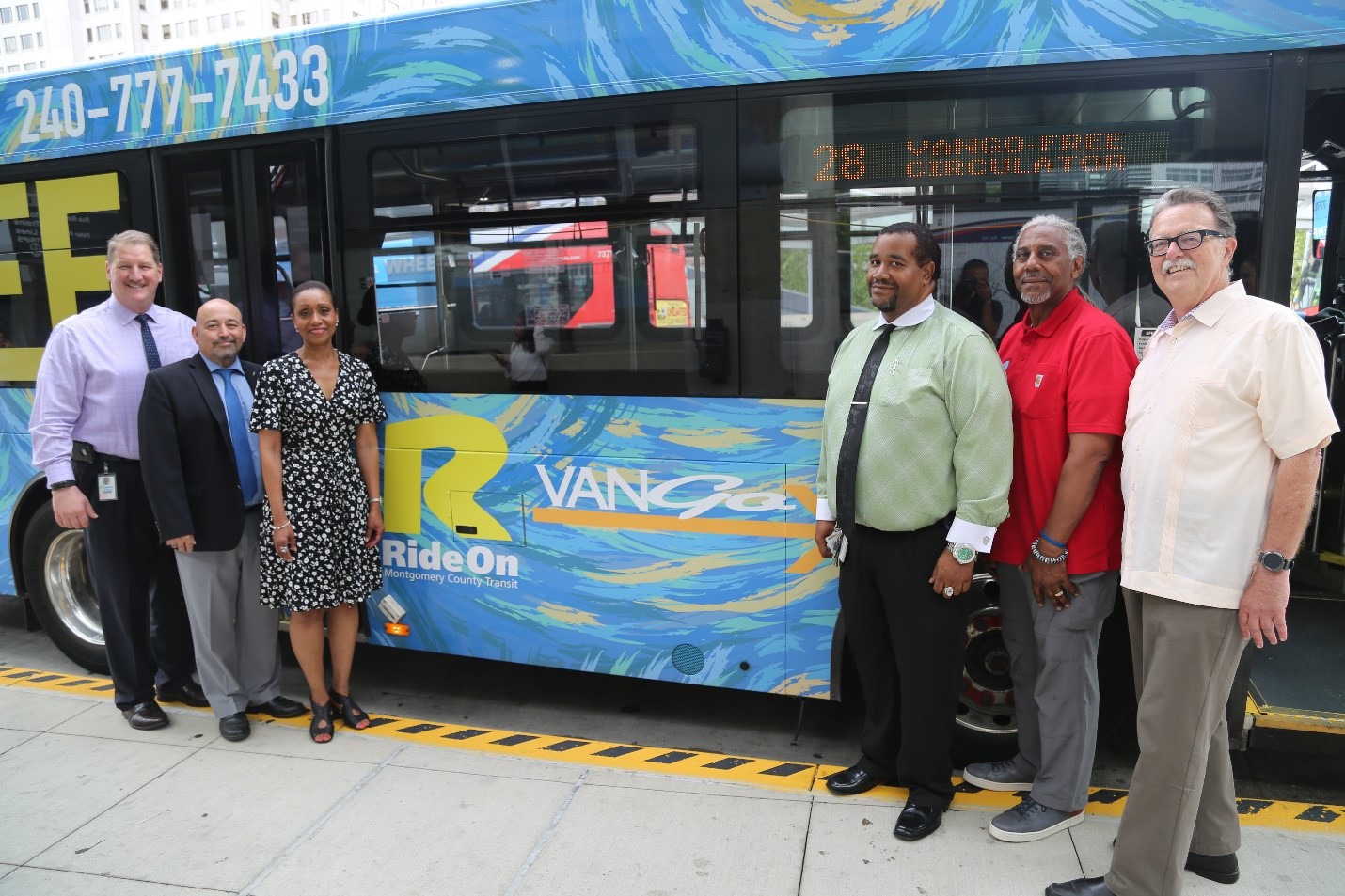 MCDOT and community leaders with newly wrapped VanGo circulator bus