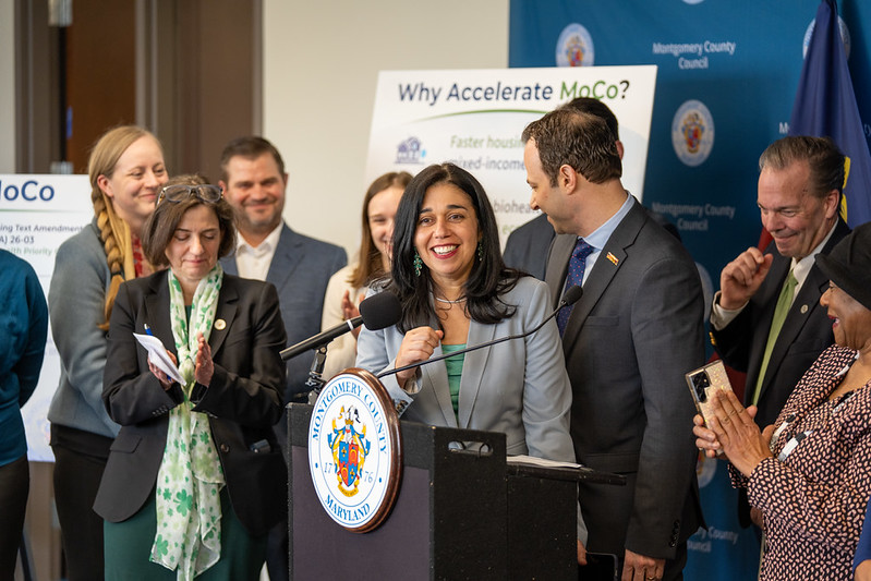 Fani-González speaks at a podium.