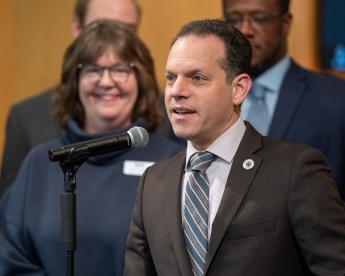 Photo of Councilmember Evan Glass recognizing National Theatre Day