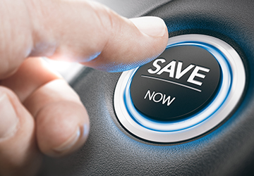 a person pushing a car start button that says 