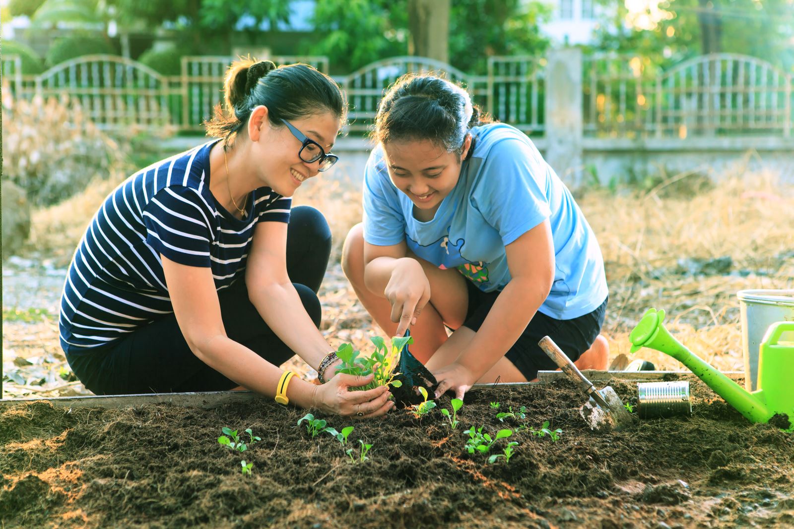 Family gardening. Photo by khunaspix 123RF Stock Photo