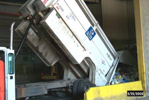 Truck unloading recyclables