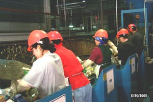 Workers at the Light Item Sort Station