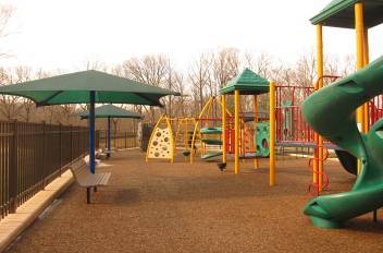 This photo shows an accessible playground that meets the new ADA requirements for recreational facilities. The playground is located at the White Oak Community Center in Silver Spring.