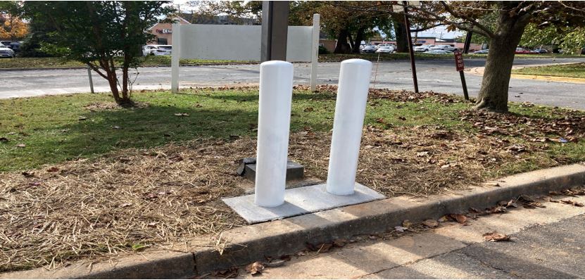 NEW BOLLARDS TO PROTECT LIGHT POLES
