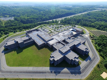 Aerial View of Montgomery County Correctional Facility with solar panels on the rooftop and ground mount.
