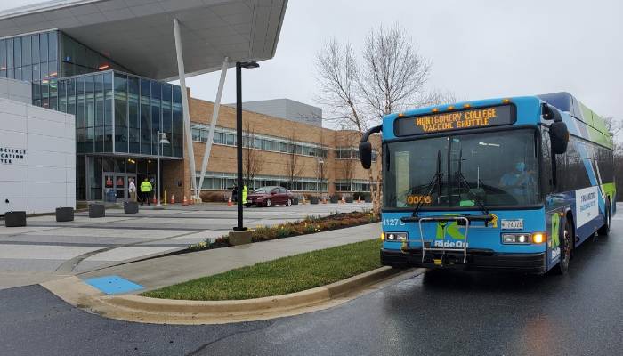 Montgomery County Vaccine Shuttle bus at the Biosciences Education Center entrance