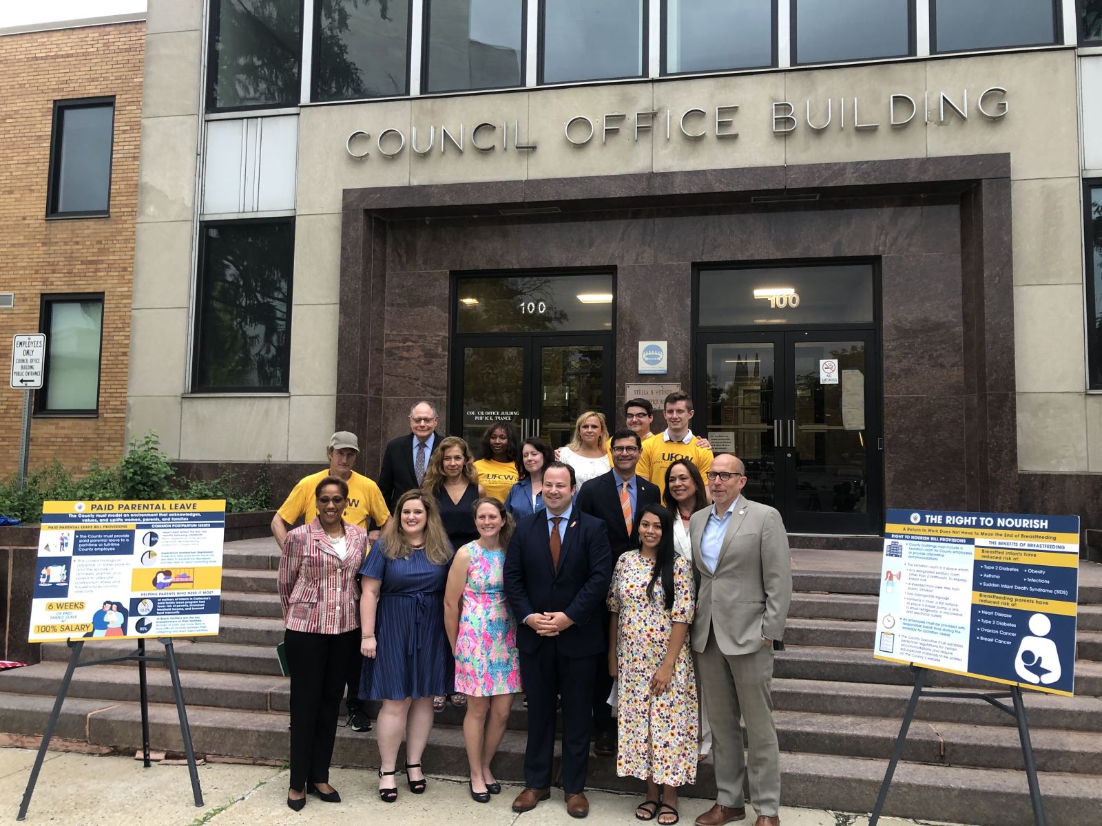 Councilmember Andrew Friedson stands with colleagues and supporters in front of the County Council Building in Rockville after a press conference presenting the two new bills.