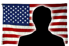 Silhouette of a servicemember in front of an American flag