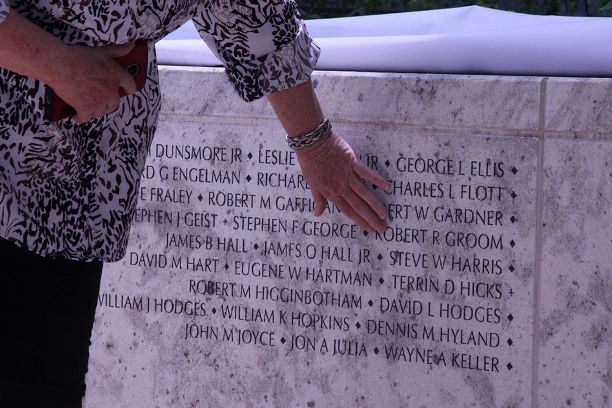 Goldstar Family Member Touches the Montgomery County Vietnam Veteran Memorial