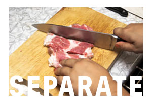 STEP 2 - Separate  - Don't Cross Contaminate - Woman slicing steak on a wooden cutting board.