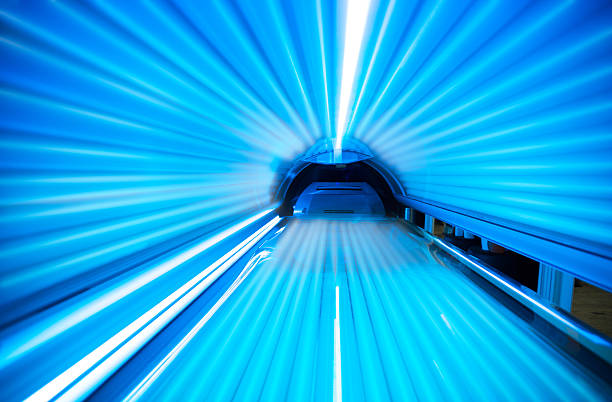 Blue lights inside a lit tanning bed