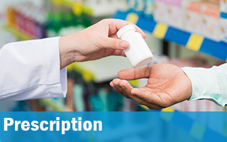 A prescription bottle being passed from one hand to another.