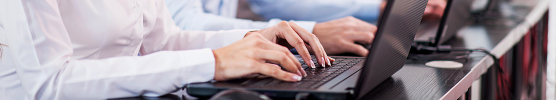 Small group of people working at computers.