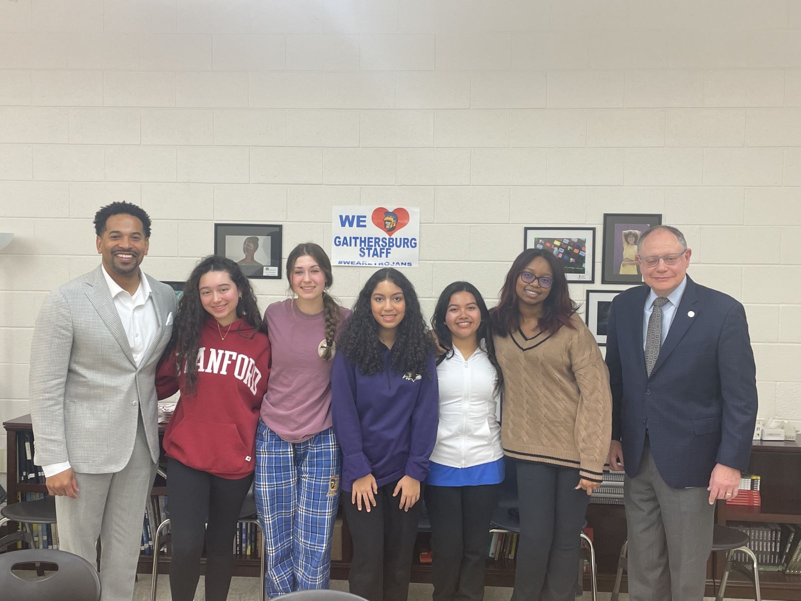 Councilmember Jawando, Councilmember Katz, and Gaithersburg High School students smile at the camera.