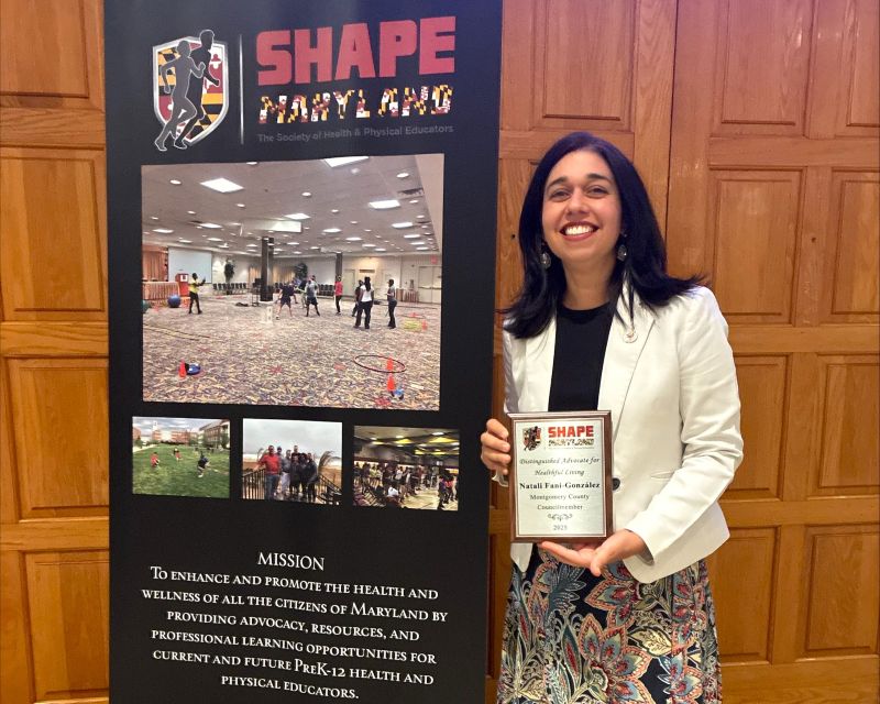Councilmember Fani-Gonzalez displays an award from SHAPE Maryland.