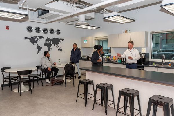 people gathering in kitchen area
