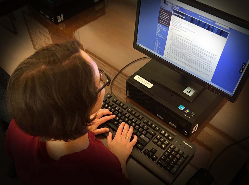 Woman typing legal terms into computer