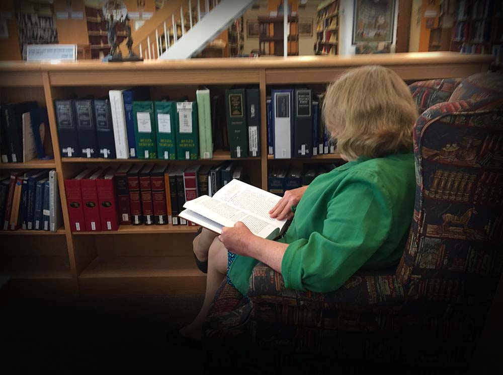 Woman reading in Law Library