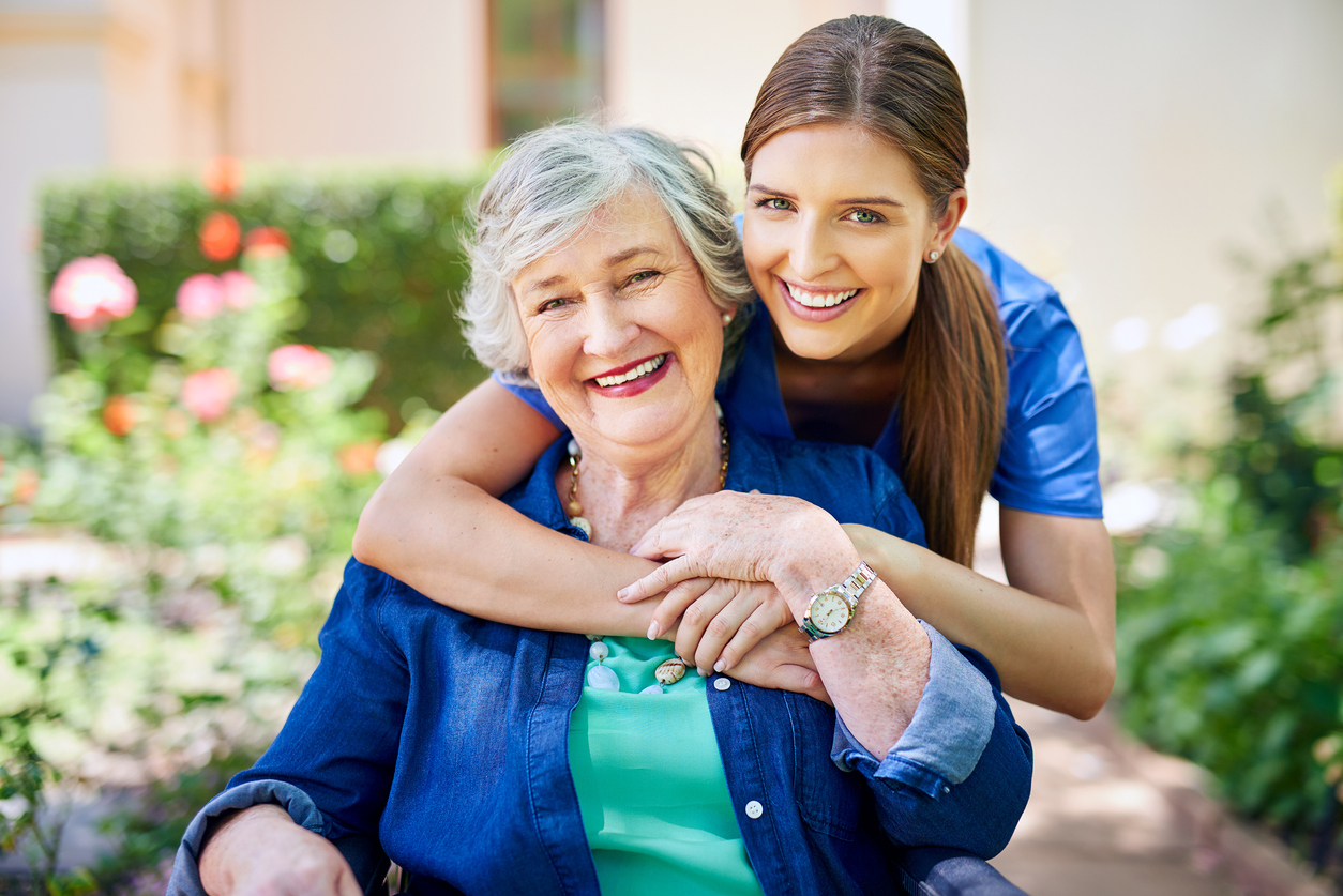 Younger woman hugging older woman