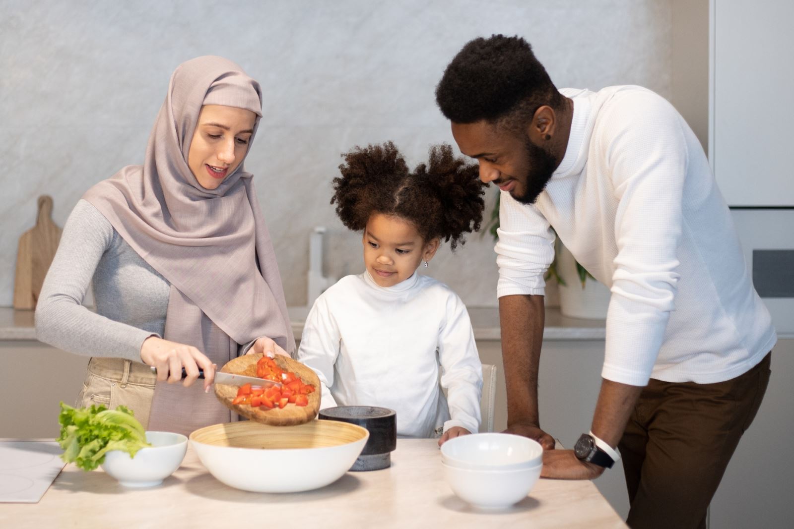 family cooking a meal in the kitchen