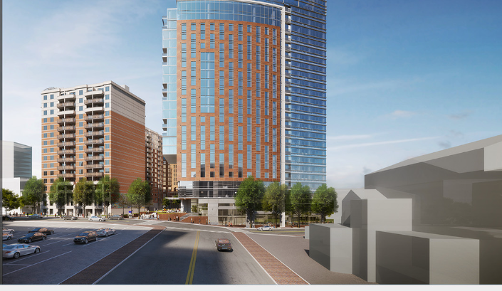 An image of two tall buildingd in an urban area.