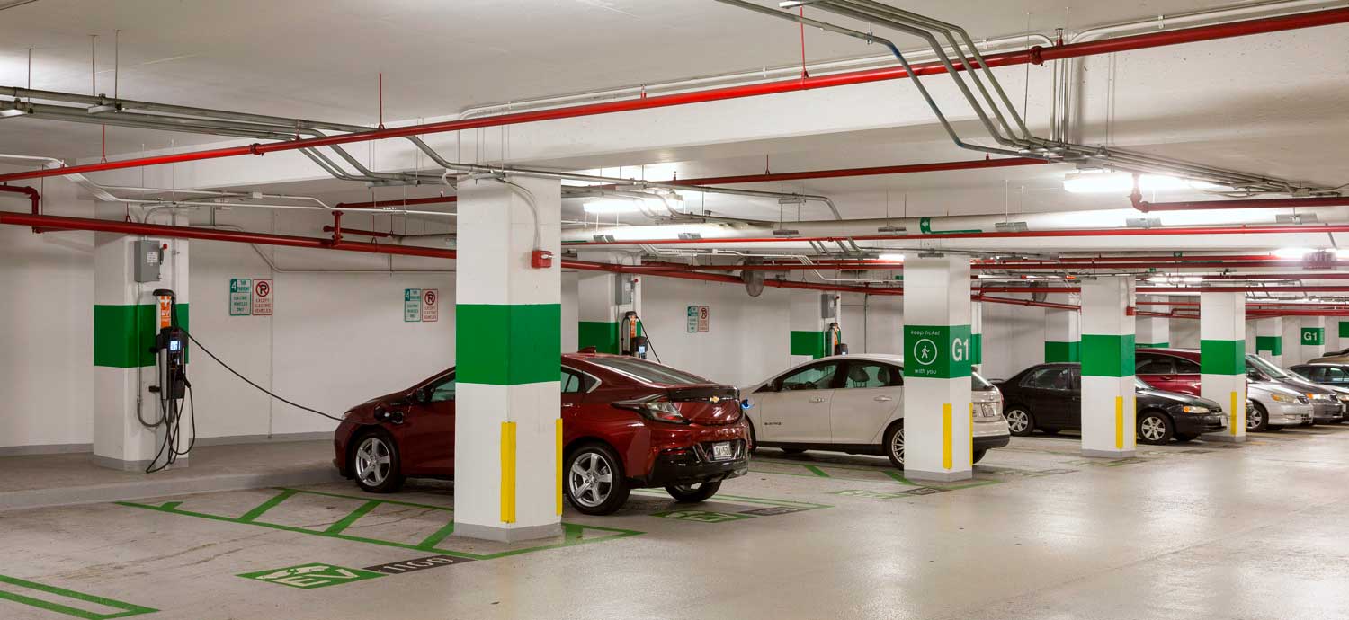 Electric cars getting charged in a garage. 