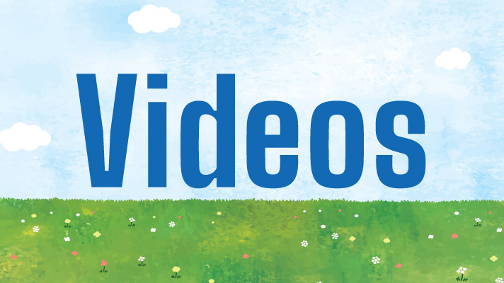 green grass with sign for videos