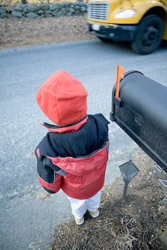 Child Pedestrian Safety - child in front of mailbox waiting for bus