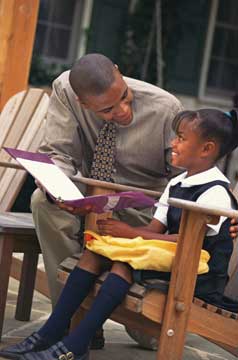 Dad reading a book to a child