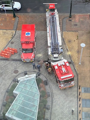 Aerial view of an ambulance and fire engine parked outside a training building