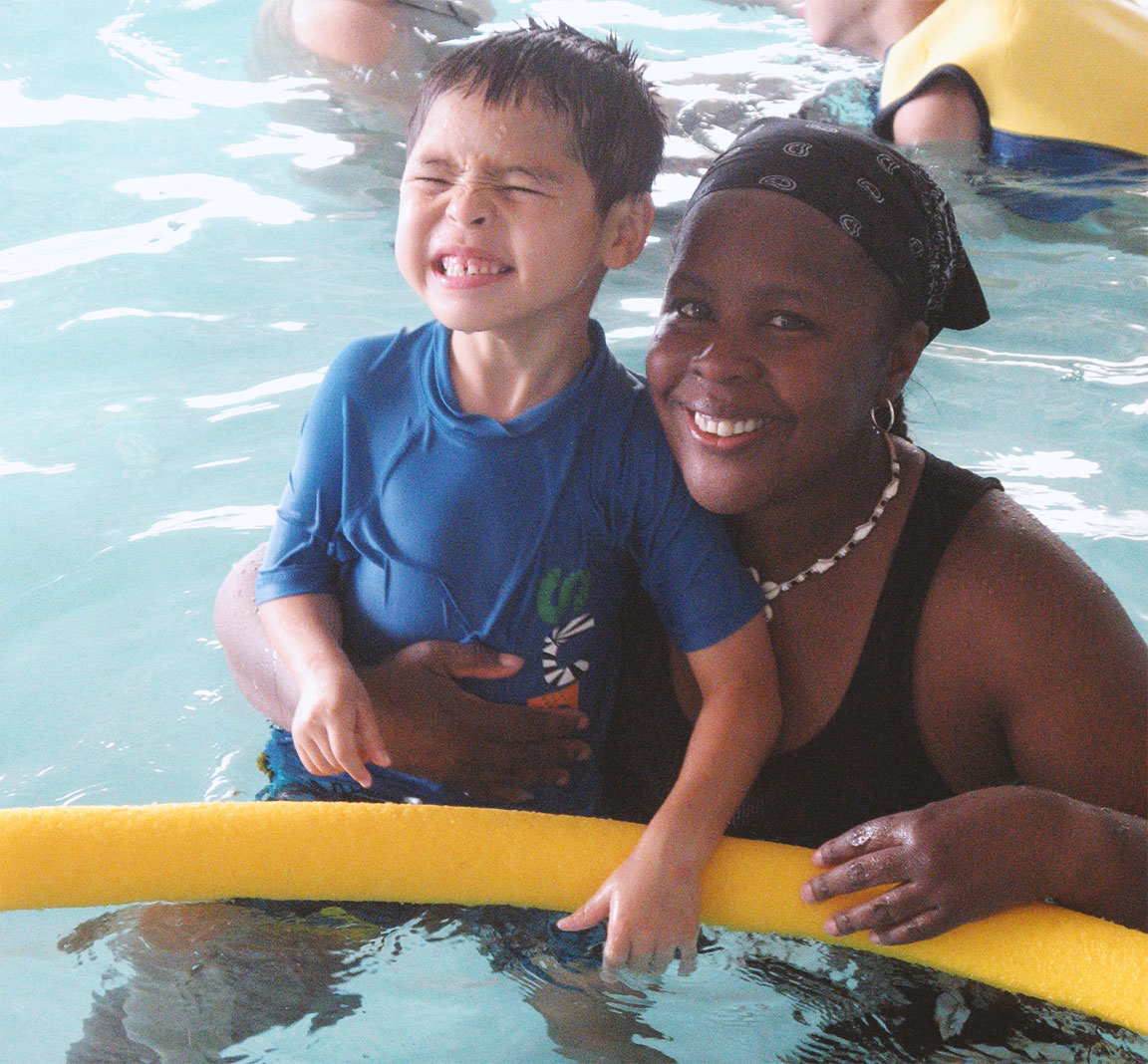 adult and child at the pool