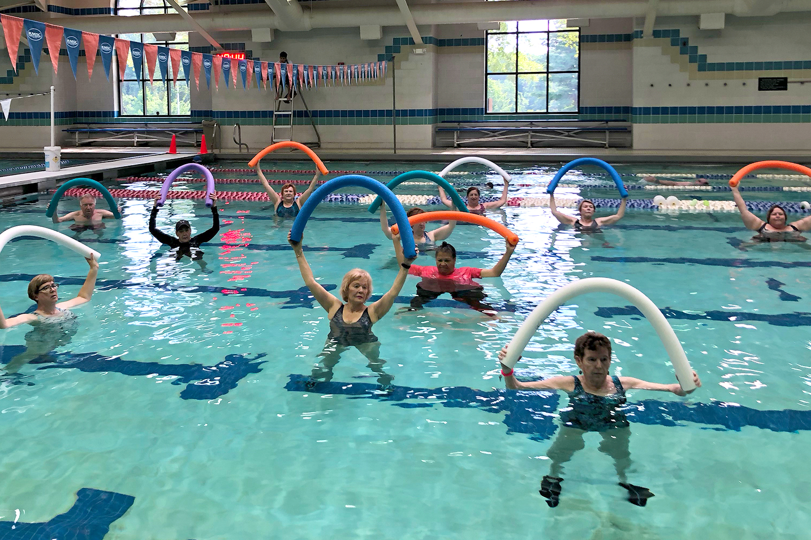 woman in shallow water aerobics class