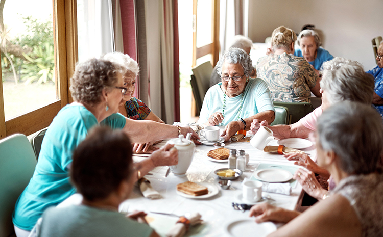 group of seniors eating breakfast