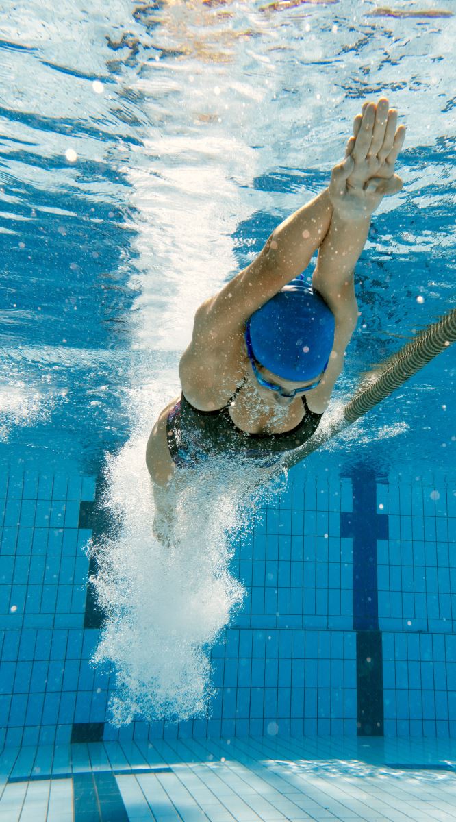 Woman in pool after dive