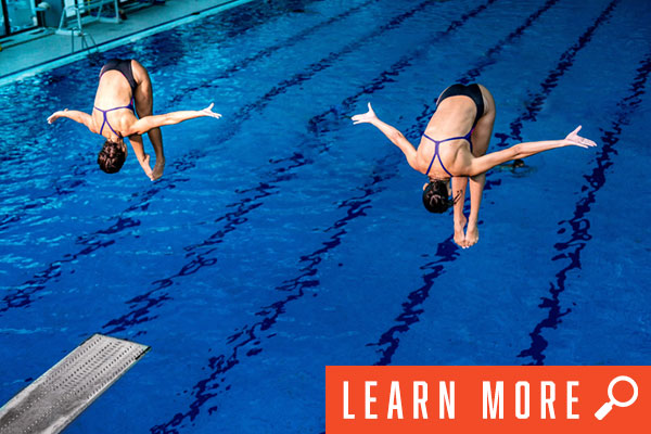 two women diving, click to learn more