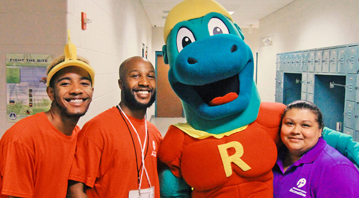 staff with T-Rex mascot