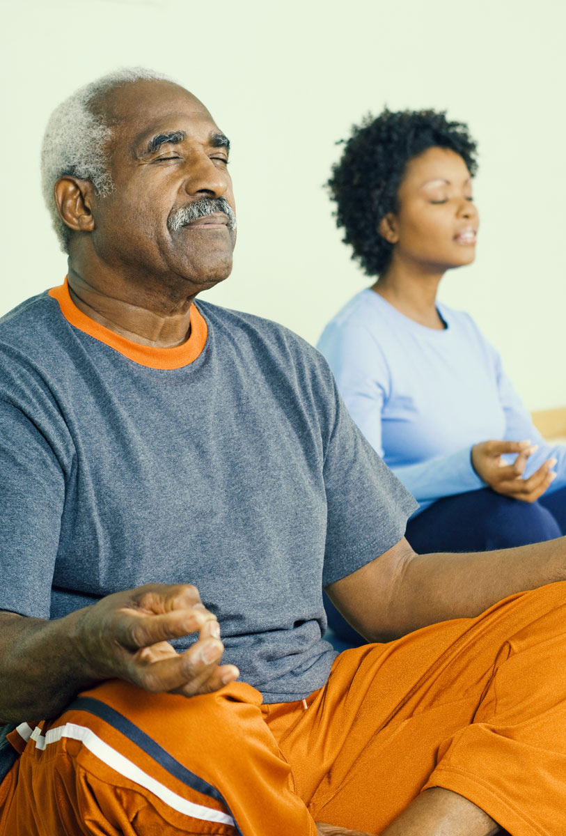 man and woman meditating