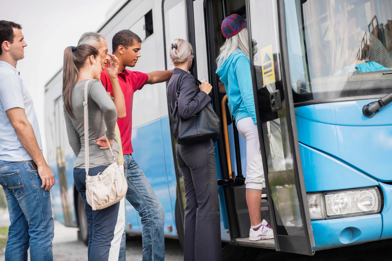 people boarding the bus