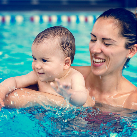 woman and infant in water