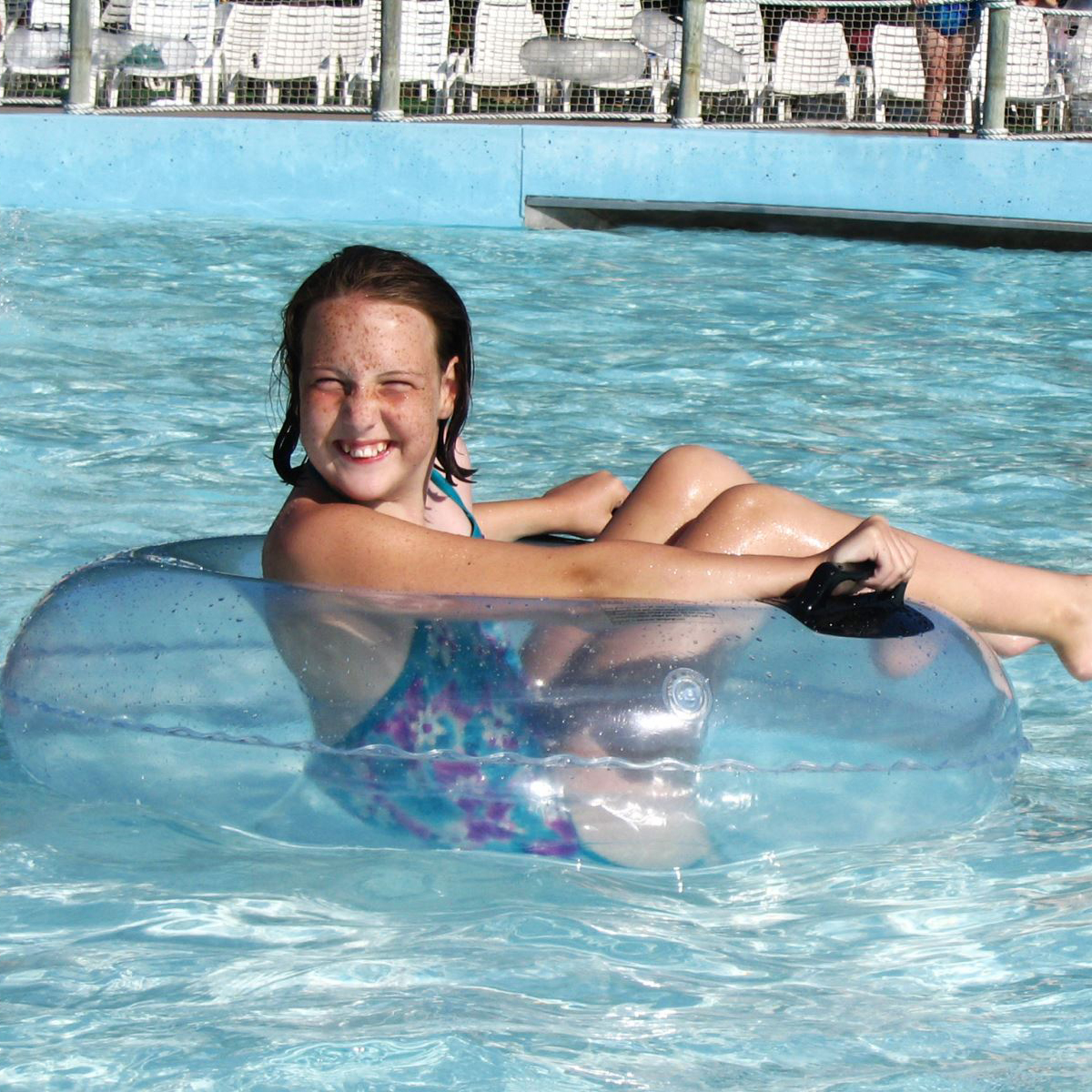 girl on pool float in water