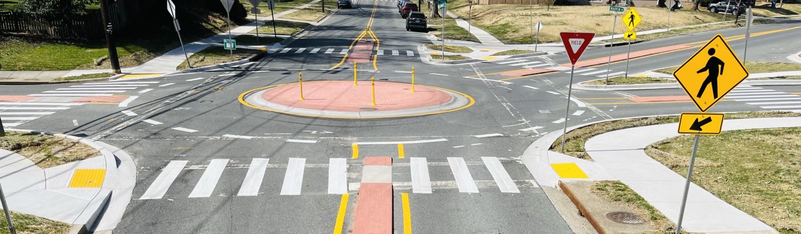 Traffic circle installed at an intersection with new pedestrian crossings marked